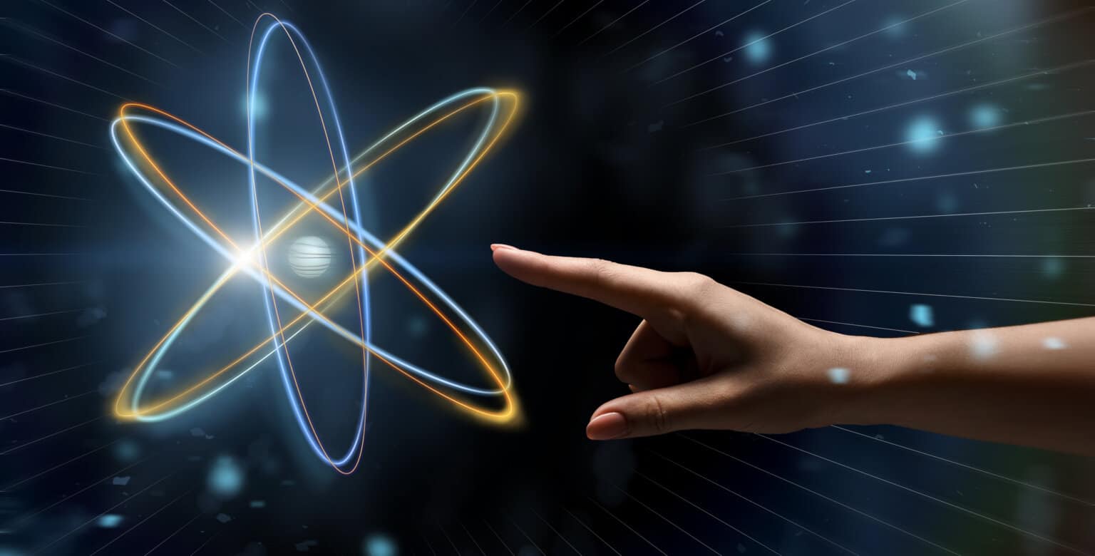 Arctic Frontiers - A hand points towards a glowing digital atom model with orbiting paths on a dark, futuristic background, reminiscent of innovation at Arctic Frontiers.