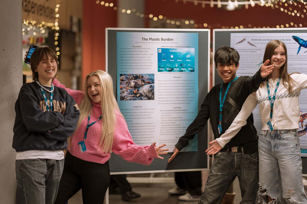Four students presenting a project.