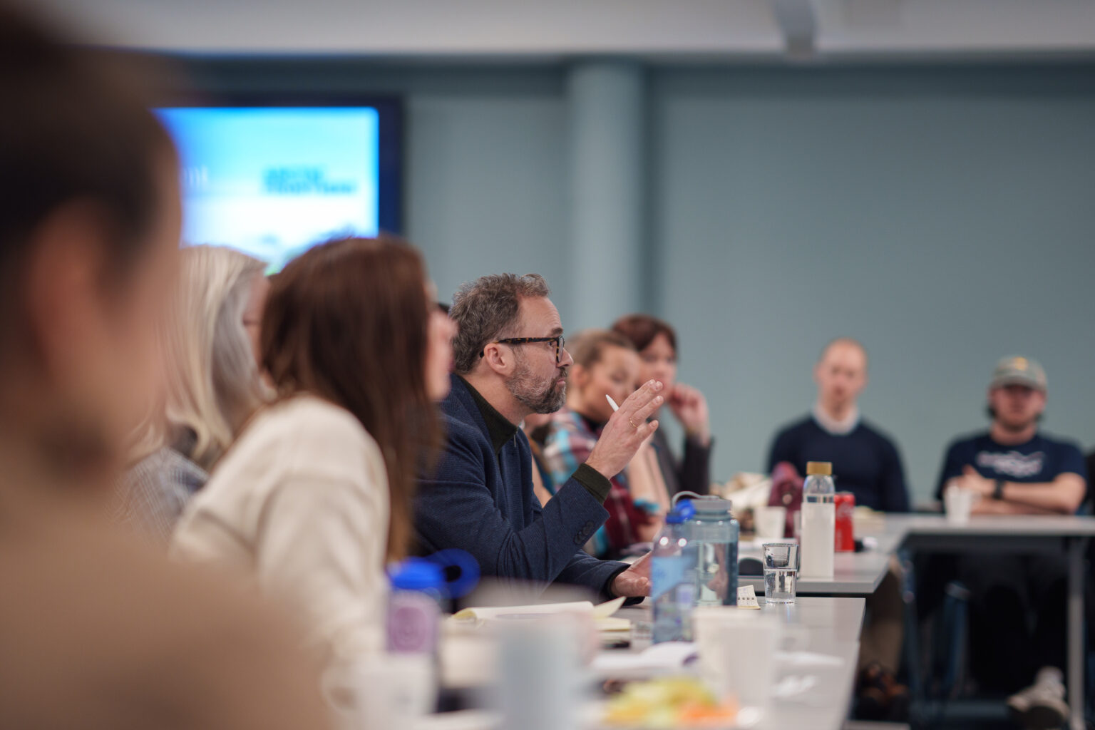 Group discussion in a meeting room.