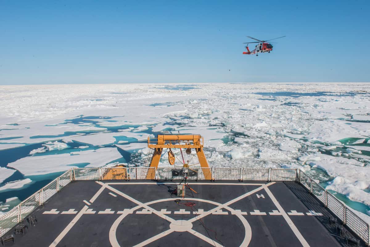 Arctic Frontiers - A helicopter flies over sea ice, viewed from the deck of a ship with a helipad in the Arctic during the Arctic Frontiers - Science 2026 conference.